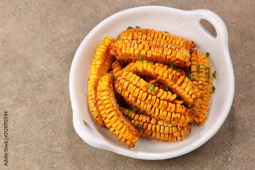 Картината върху платно Corn ribs are processed grilled corn that is shaped like ribs.