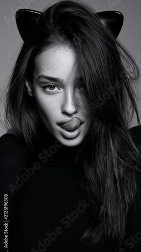 woman with cat ears, elegant female fashion portrait with feline style and dramatic makeup