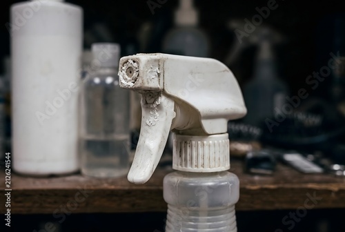 Macro close up of a pet deodorizing spray bottle plastic nozzle with dried residue