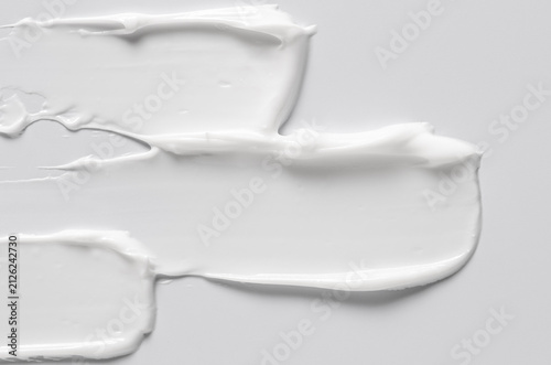 The white texture of cosmetic body cream. Copy space
