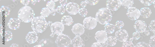 Close-up of multicolored soap bubbles floating against a black background on transparent background