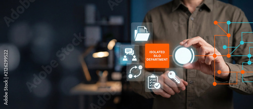 Business professional interacting with a digital interface representing an isolated silo department in a corporate environment