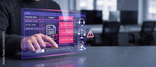 Business professional using a futuristic digital interface to manage overdue invoices and automate dunning letters for corporate clients