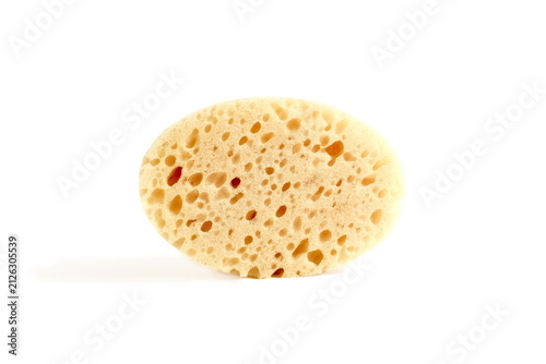 Bild auf Leinwand There is one dishwashing sponge lying on a white background.