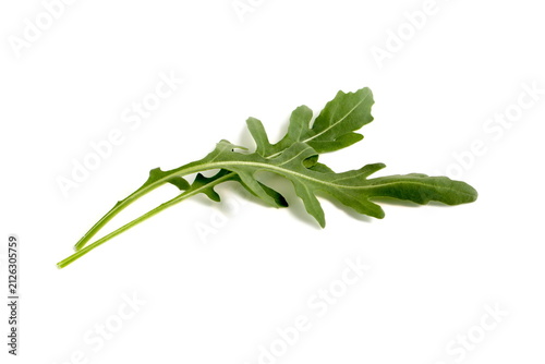 Arugula leaves lie on a white background.