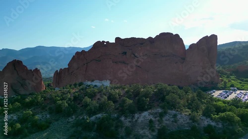 Flying dramatically sideways facing large rocky cliff in Colorado