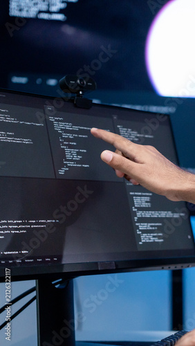 Принти на полотні Close up shot show hand software engineer pointing to computer screen, checking for error or inaccurate in the coding Cyber security