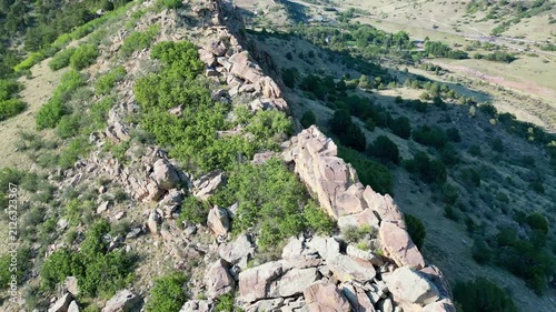 Aerial perspective of Bighorn sheep on top of rocky cliff