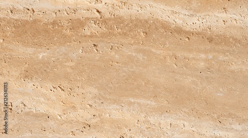 Close-up of a light beige travertine stone wall texture with natural veining and pits stone texture natural stone