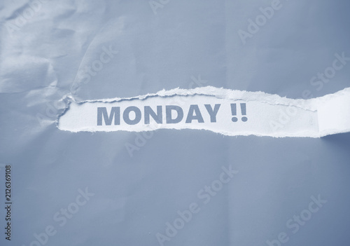 Canvas Print The word MONDAY is written on the back of a torn piece of paper—a reminder that Monday has arrived; a day that makes some workers and students feel lethargic