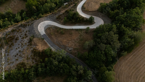 Bild auf Leinwand Aerial view of a winding mountain road