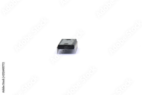 A blurry microcontroller on a white background. An archaic concept of technological advancement.