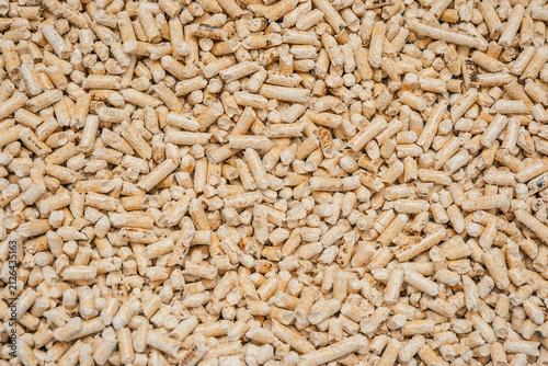 soft focus, Wood pellets are stacked together in  large pile at  storage site during daylight hours. soft focus.  pellets made from compressed wood fibers. biomass is used as fuel