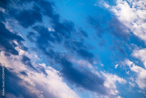 Canvastavla Dark dramatic clouds across blue sky background