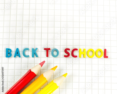 Back to School Colorful Text with Pencils on Graph Paper