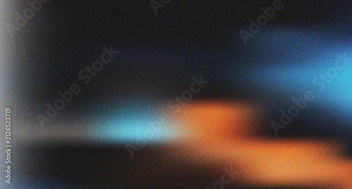 Mysterious dark gradient featuring a captivating interplay of blue light and warm orange tones with grain