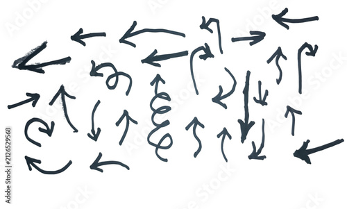 Set of hand drawn arrows sketches on paper