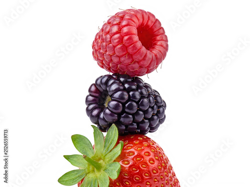 A vibrant stack of fresh berries featuring a bright red raspberry balanced on a dark blackberry sitting atop a juicy ripe strawberry isolated black