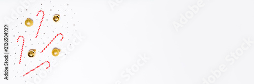 White holiday background with candy canes, gold baubles and silver stars on left side, leaving wide copy space for festive banners, sales, greetings and seasonal promo designs.