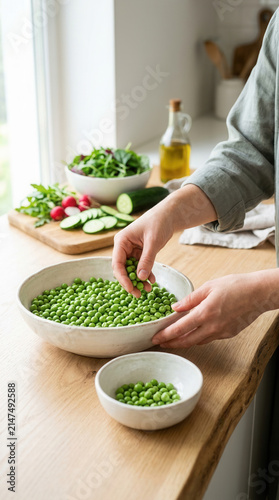 Fresh Green Peas Being Sorted For A Healthy Kitchen Meal Preparation Scene