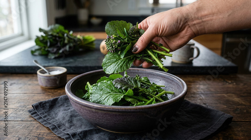 Fresh Greens Being Added To A Rustic Bowl For A Healthy Meal Preparation