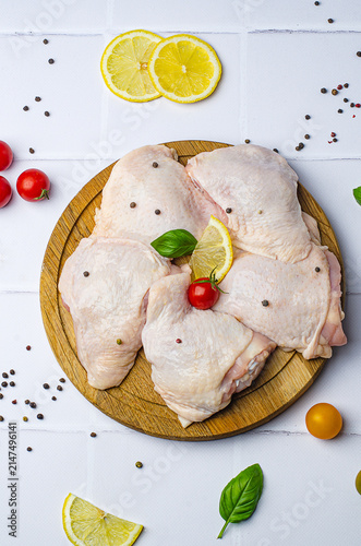 raw chicken legs, raw chicken thighs on a white background, raw chicken thighs on a wooden board