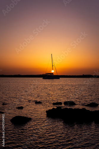 sailboat at sunset in Greece