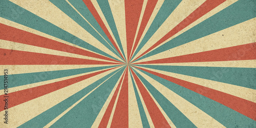 Vintage sunburst background with red and blue rays. Retro starburst pattern texture.