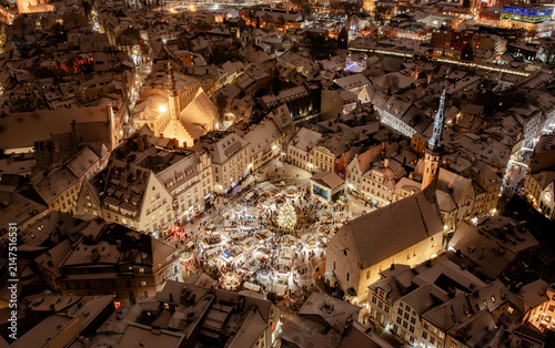 Aerial night View of Tallinn with the Town Hall Square in winter, roofs with snow, Christmas mood