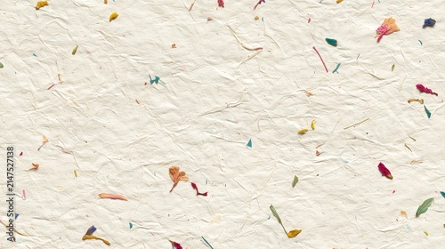 Ivory handmade paper with subtle fiber textures and very tiny colorful fleck. Organic and recycled paper background.	