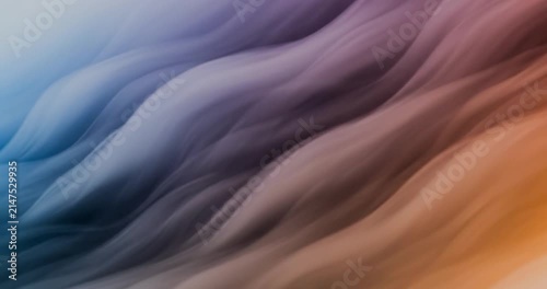 Abstract flowing fabric waves in blue and purple.