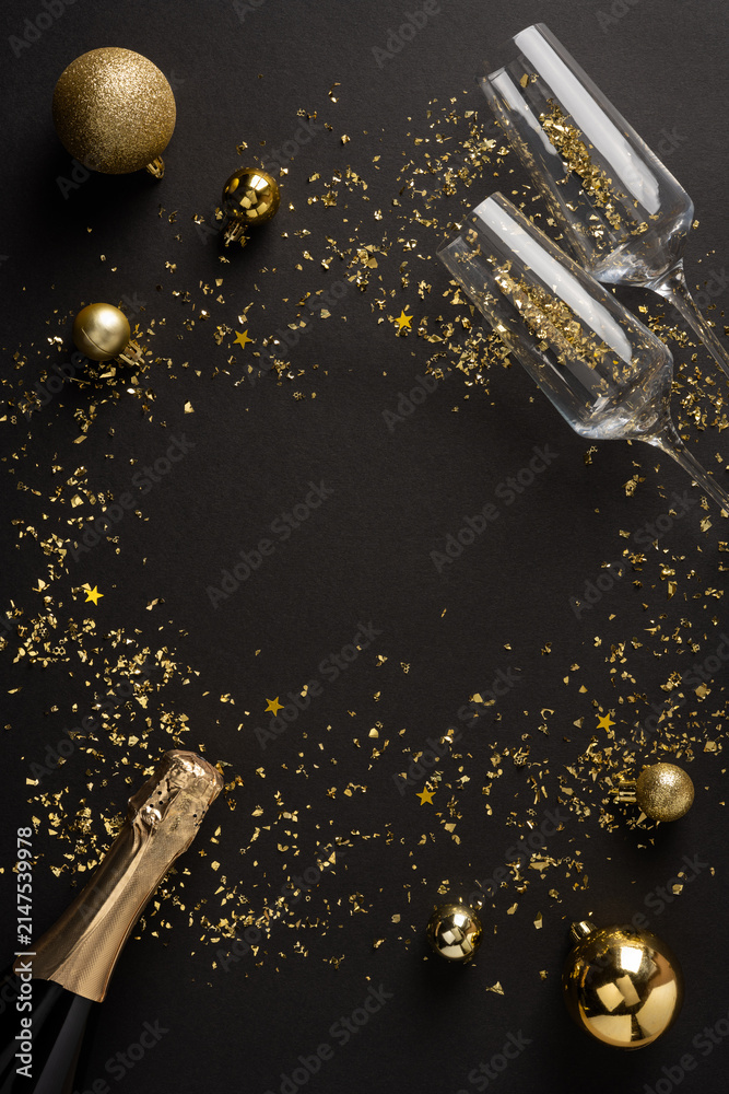 Obraz premium Happy New Year 2027 celebration with champagne, gold confetti and ornament on dark vertical background
