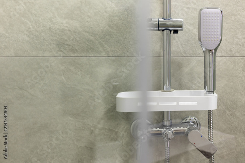 shower head and mixer tap in luxury bathroom