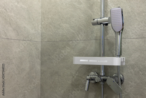 shower head and mixer tap in luxury bathroom