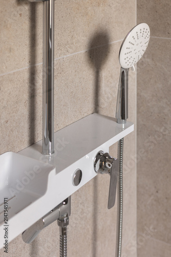 Close-up of premium modern shower head and mixer tap in luxury bathroom