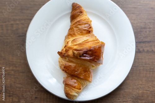 Canvas Print Close-up of fresh cheese croissant served on white plate