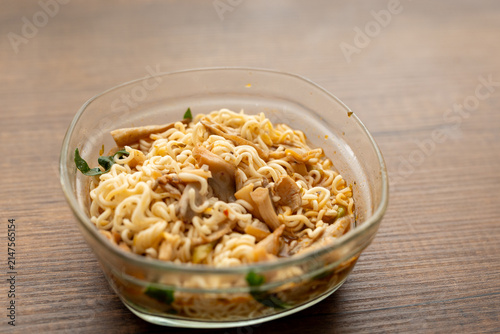 Close-up of mushroom ramen soup served in transparent glass bowl