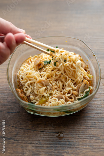 Close-up of mushroom ramen soup served in transparent glass bowl