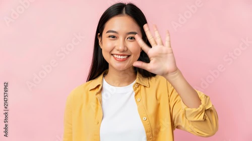 Young Woman Showing Five Fingers