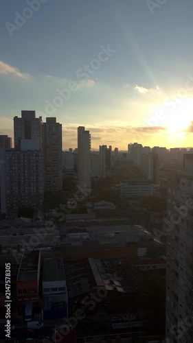 Sunset between buildings in the Lapa neighborhood of Sao Paulo_vertical.