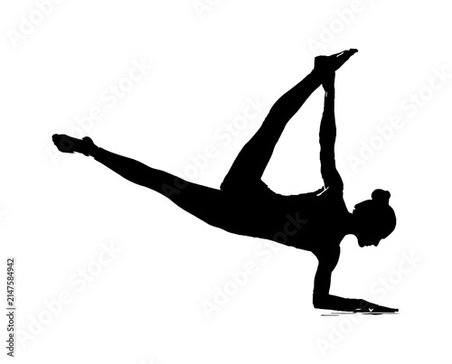 Fotografie Silhouette of a woman performing an advanced yoga pose eka pada koundinyasana ii