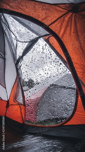 Close-up shot of an outdoor camping tent during rainy weather 