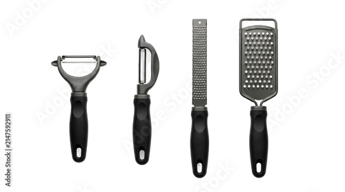 Collection of essential kitchen peeling and grating tools isolated on a transparent background.