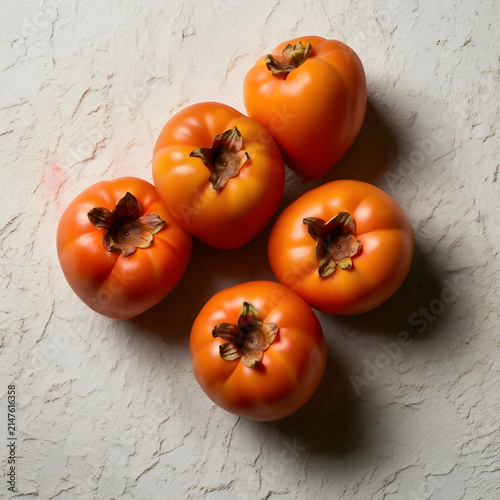 Five ripe orange persimmon ...
