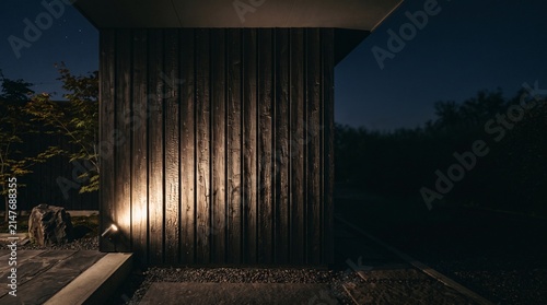 Illuminated Wooden Corridor and Pillars in Ancient Japanese Architecture at Night