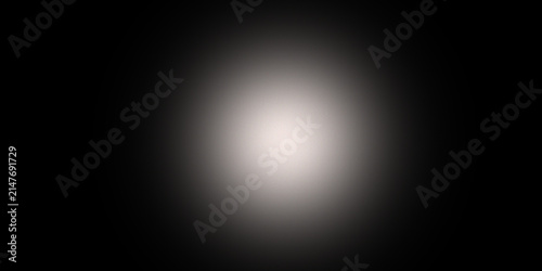 A Soft White Circular Glow Emanating From The Center Of Dark Space