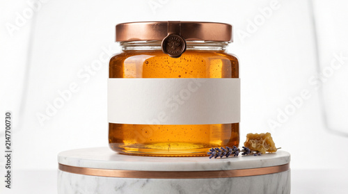 Luxury honey jar mockup with blank label on marble. Includes copper lid, lavender, and honeycomb accents.