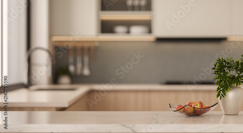 Marble kitchen island tabletop with bowl of apples close up