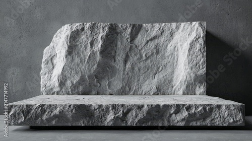 A striking gray marble podium showcasing broken stone slabs. 