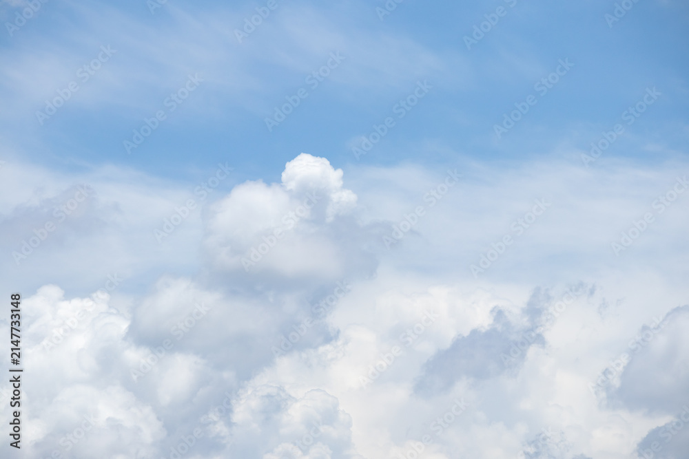 Fototapeta premium fluffy white clouds building up in the light blue sky